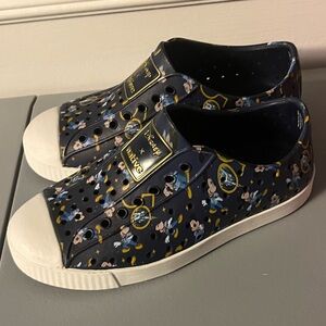 Native x Disney Black and White Slip-On Sneakers